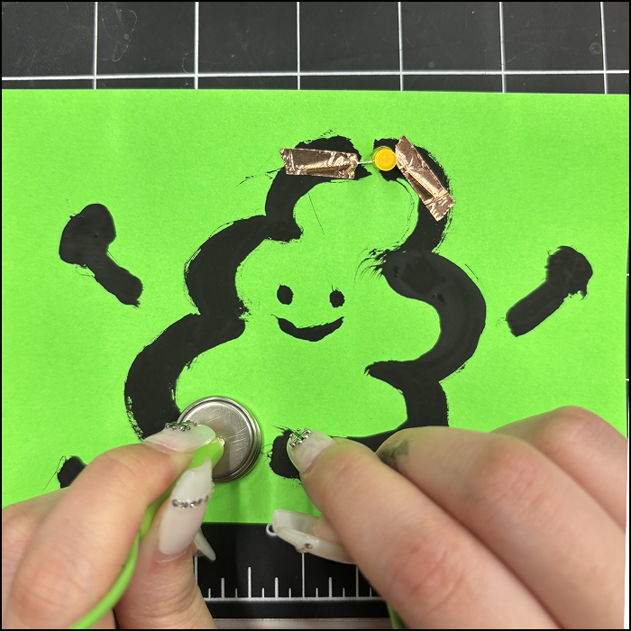 I doodled an image and lit it up using alligator clips.