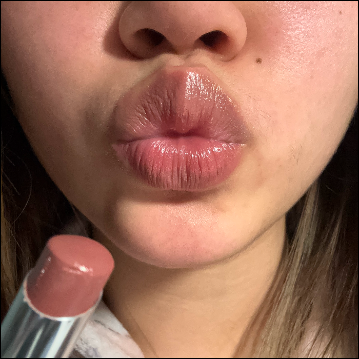 The sound of applying my lipstick; make sure the application is even by smacking my lips, and finally creating a smoosh sound.