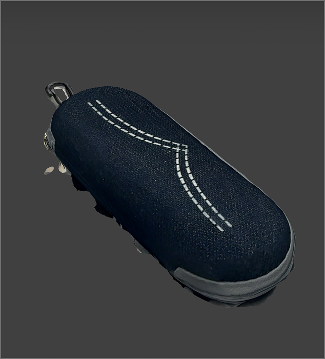 Another view of the eyeglass case. The light and shadow are well-defined.